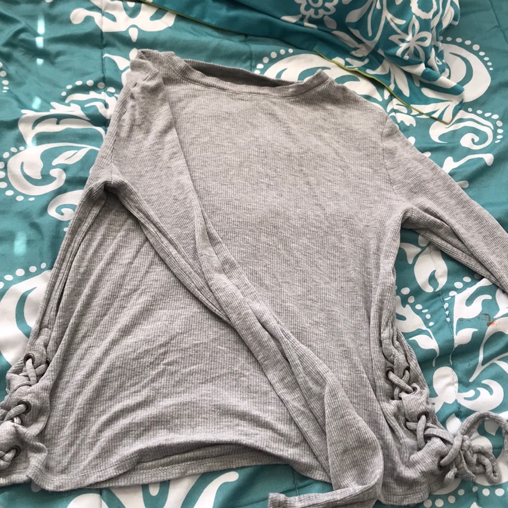 a long sleeve shirt with ties at the ends